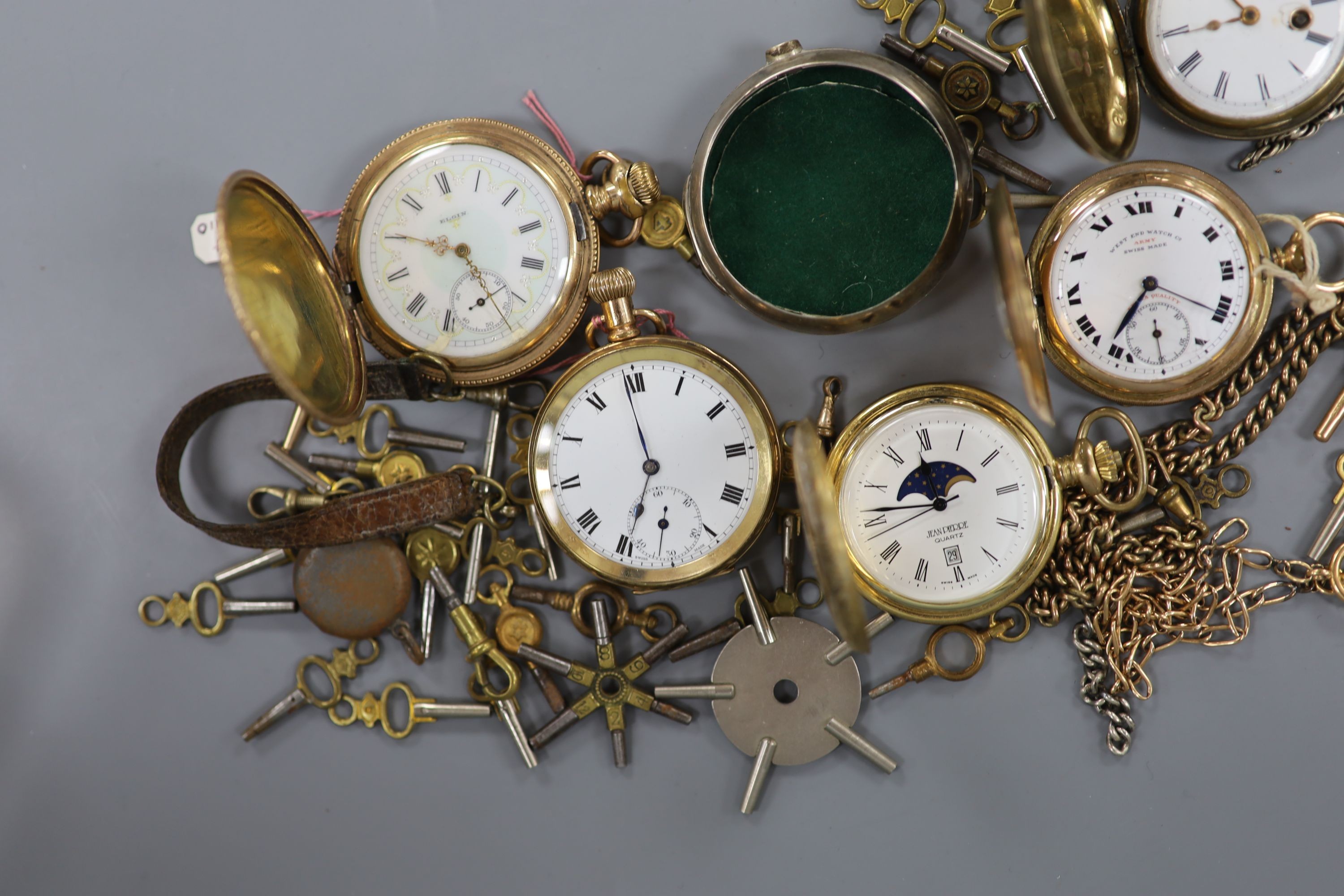 An early 20th century gold plated keyless pocket watch, a gold plated half hunter, three other pocket watches and watch accessories, including keys.
